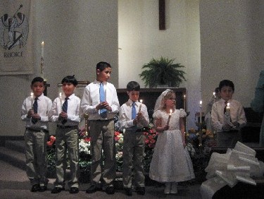 Lighting their Baptismal Candles